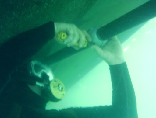 Diver installing a zinc anode underwater